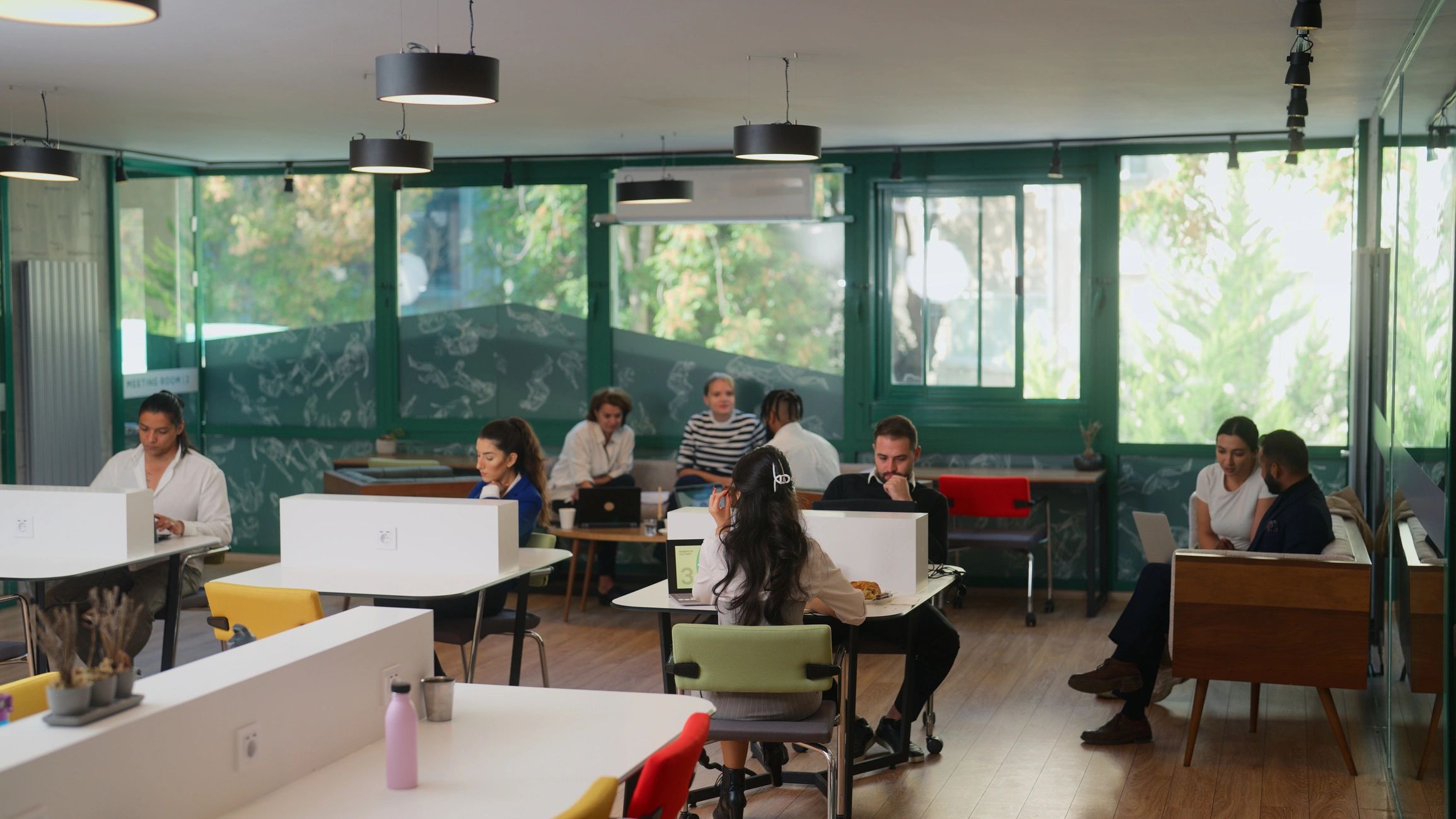 Team meeting in a modern office discussing business setup