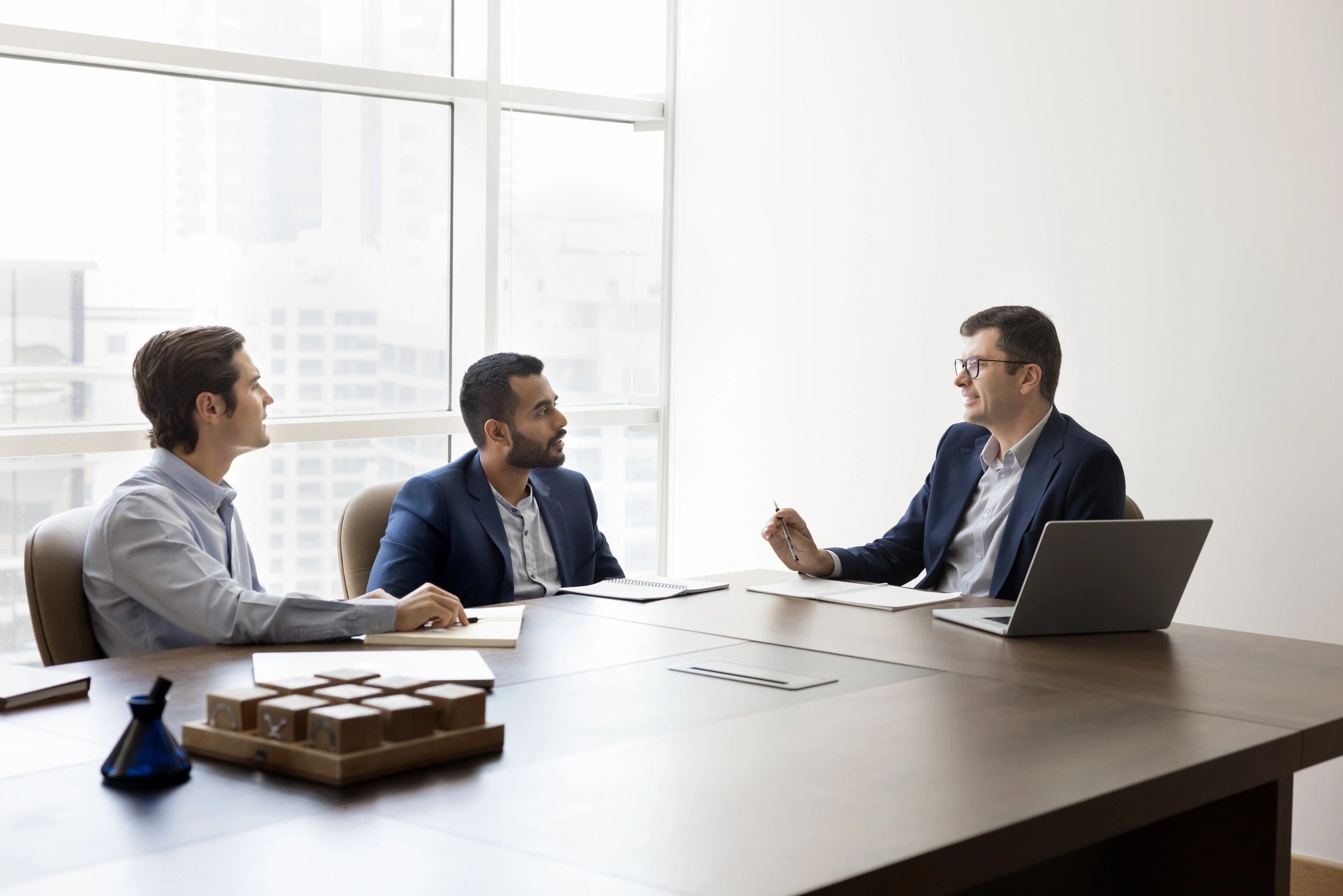 Accounting and compliance professionals meeting in an office