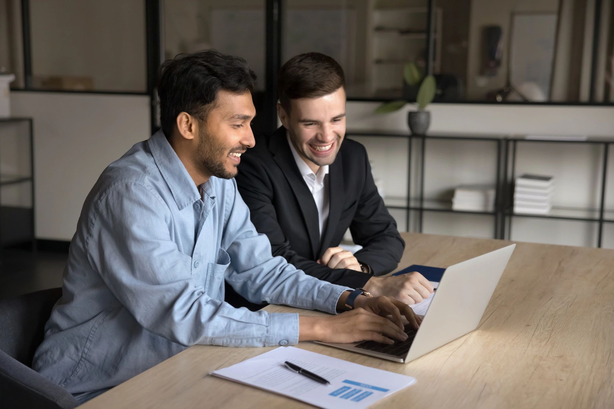 Busy CEO collaborates with colleague in board room