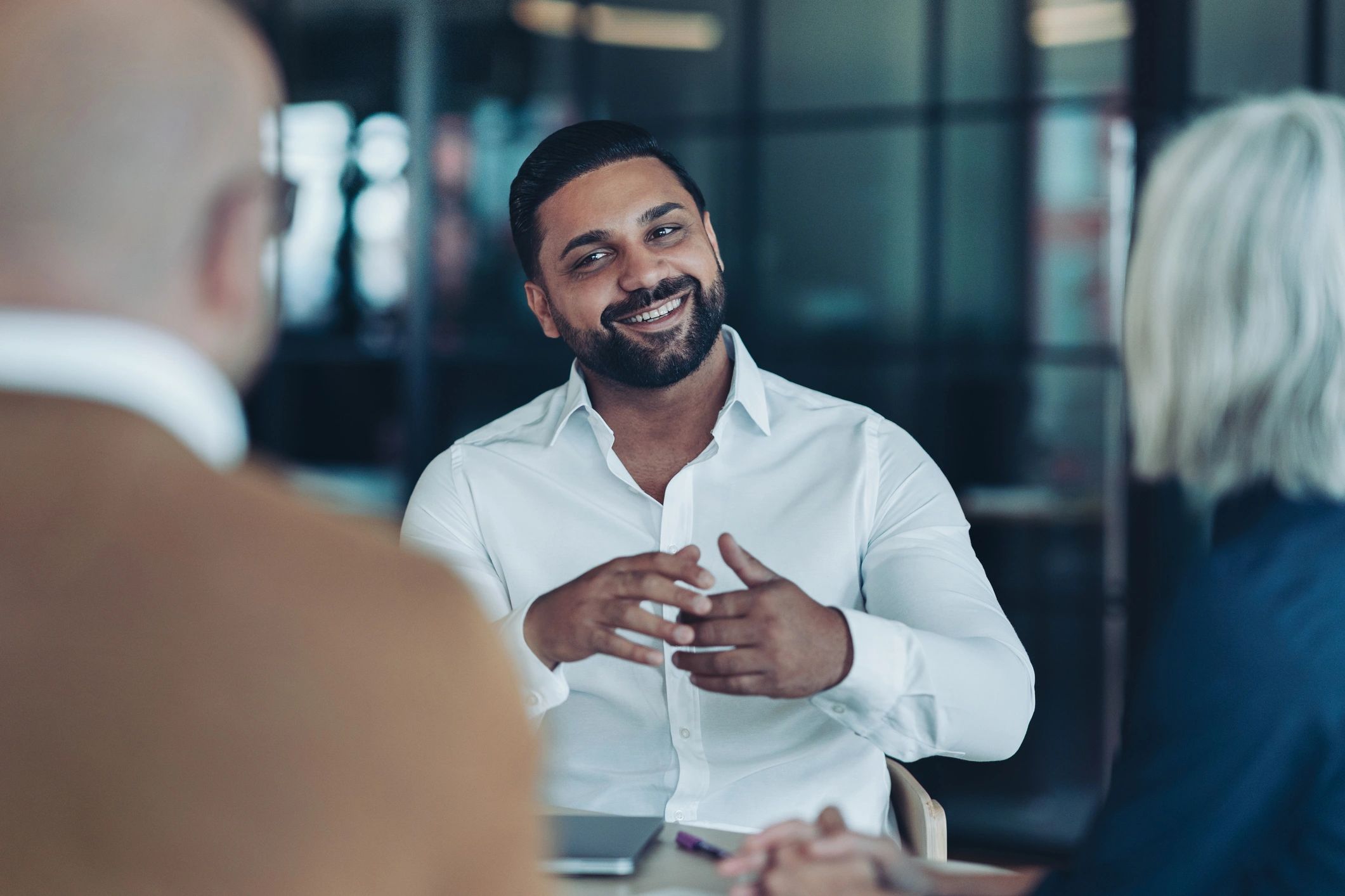 Business professional discussing documents with colleagues