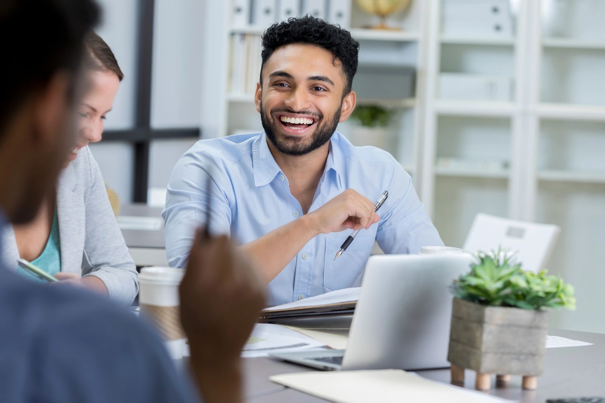 Business professional discussing documents with colleagues